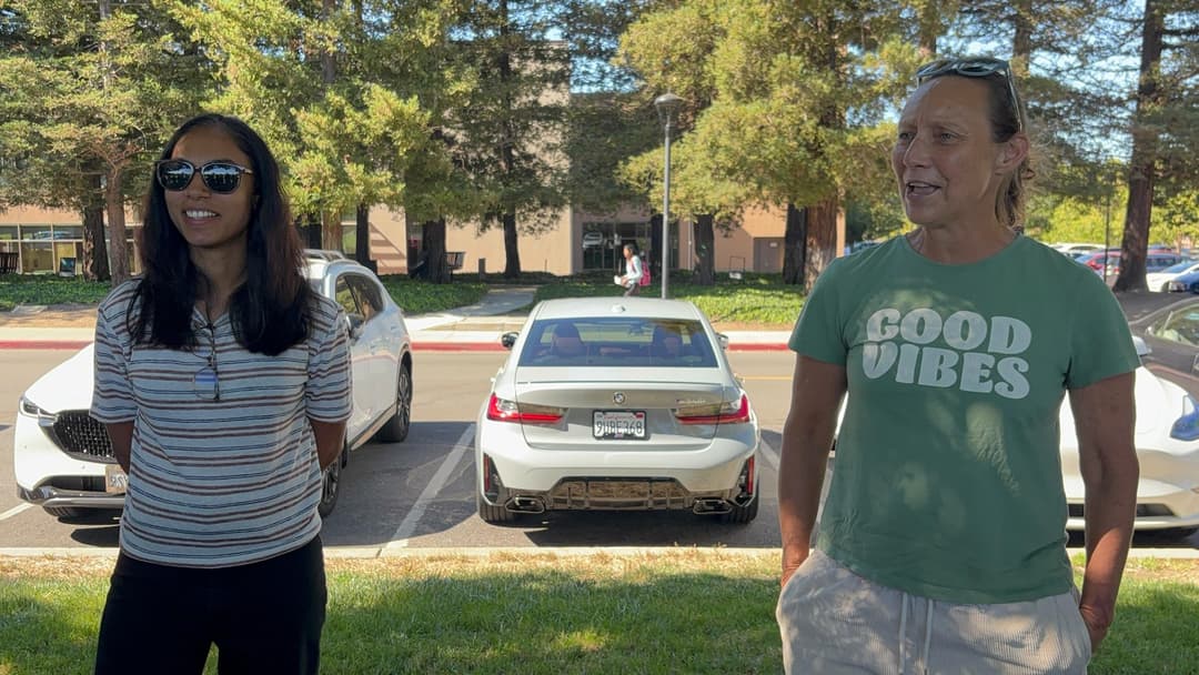 Two female having a conversation.
