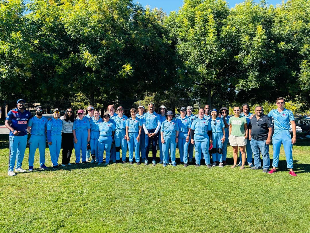 The team standing together with the guests for the picture.